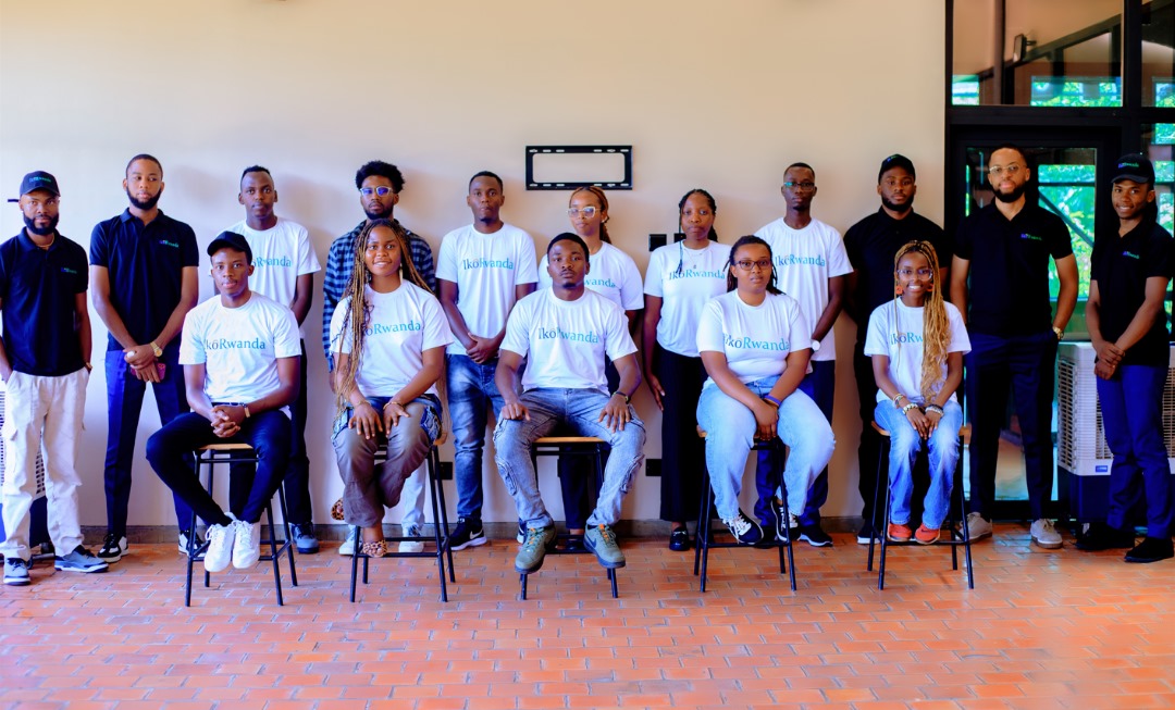 Full IkoRwanda cohort group photo — branded white and navy shirts